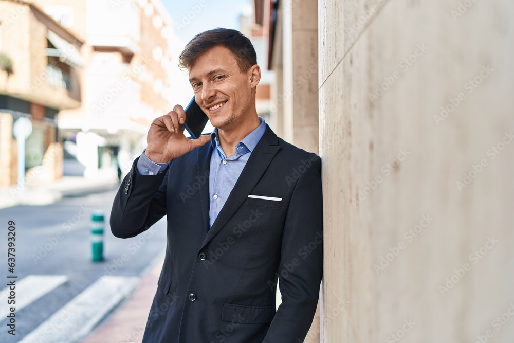 Young man business worker smiling confident talking on smartphone at street Young man business worker smiling confident talking on smartphone at street