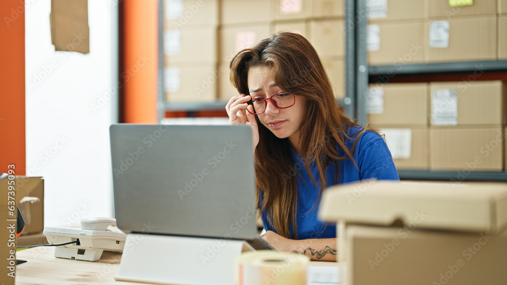 Young beautiful hispanic woman ecommerce business worker using laptop working stressed at office Young beautiful hispanic woman ecommerce business worker using laptop working stressed at office