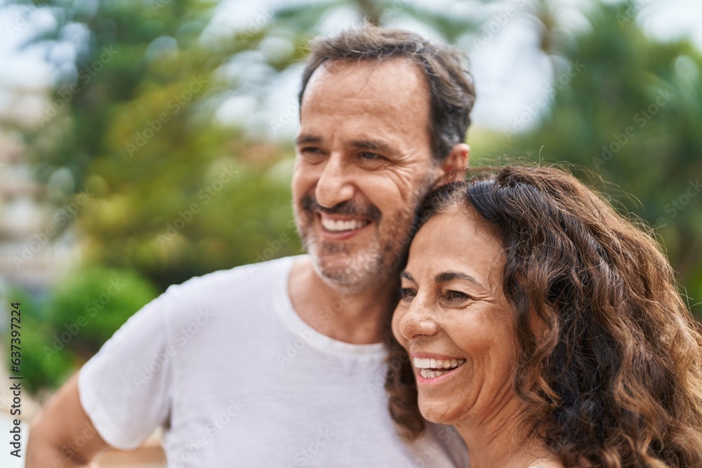 Man and woman couple smiling confident standing together at park