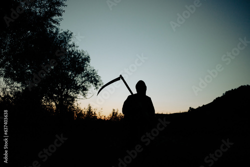 grim reaper, the death itself, scary horror shot of Grim Reaper holding scythe