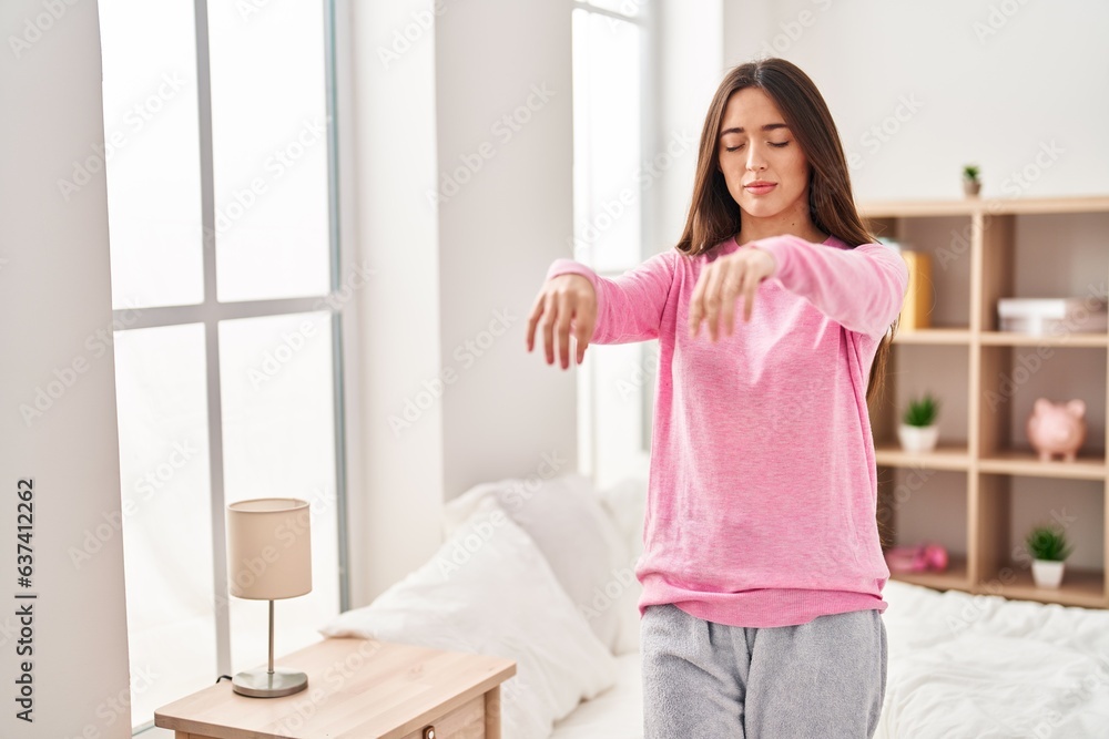 Young beautiful hispanic woman somnambulist sleepwalking at bedroom