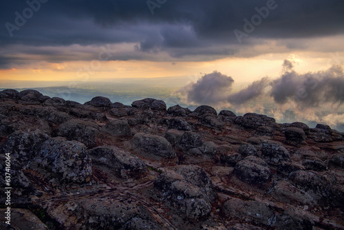 Beautiful sunset before the rain  at  Lan Hin Pum, tourist attration in Phu Hin Rong Kla National Park in Phitsanulok, Thailand photo