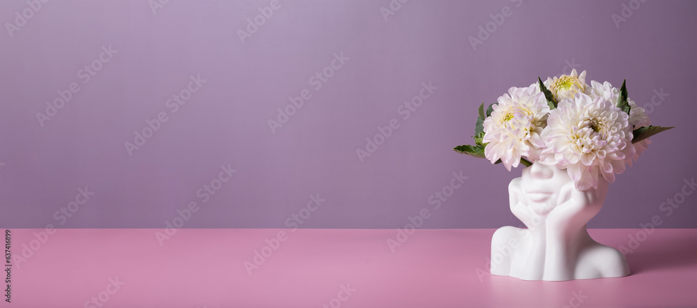 Plaster head with flowers on a colored banner background. Mental health concept. Copy space Plaster head with flowers on a colored banner background. Mental health concept. Copy space