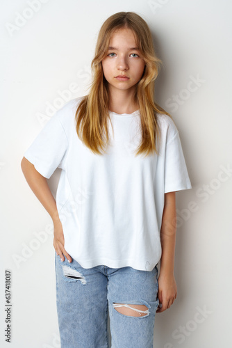 Portrait of young beautiful cute teen girl posing at camera