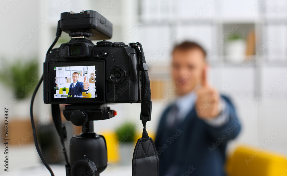 Male in suit and tie show confirm sign arm making promo videoblog or photo session in office camcorder to tripod closeup. Vlogger promotion selfie solution or finance advisor management information Male in suit and tie show confirm sign arm making promo videoblog or photo session in office camcorder to tripod closeup. Vlogger promotion selfie solution or finance advisor management information