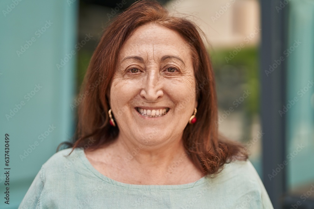 Senior woman smiling confident standing at street Senior woman smiling confident standing at street