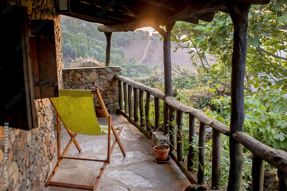 Beautiful medieval village Talasnal in Lousa, Portugal on a beautiful day. Child playing on the street of the village with his pet dog