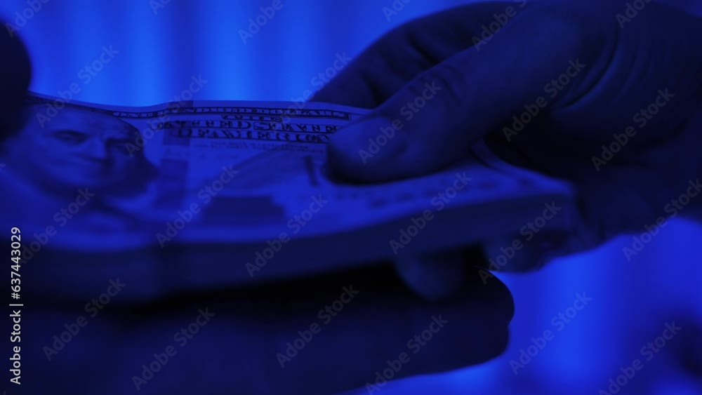 Give wad of cash. Counting American 100 dollar banknotes. Businesswoman counts the bills of money, rich woman shifting a stack of 100 US dollars by hands. Give wad of cash. Counting American 100 dollar banknotes. Businesswoman counts the bills of money, rich woman shifting a stack of 100 US dollars by hands.