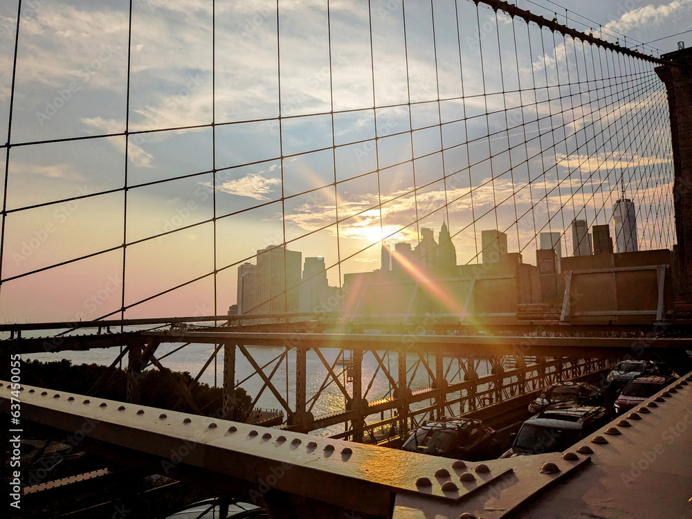 Obraz premium sunset by Brooklyn Bridge