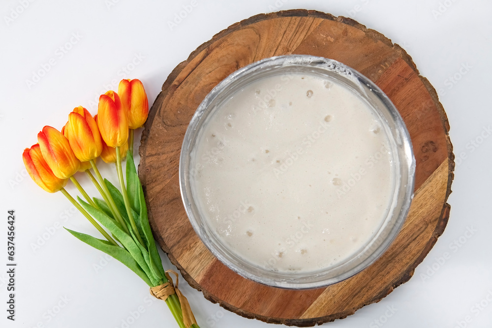 Selective focused image of fermented batter for idli and dosa in an isolated background. Idly and dosa batter in a bowl for fermentation, used to prepare the dosa and idli.. Selective focused image of fermented batter for idli and dosa in an isolated background. Idly and dosa batter in a bowl for fermentation, used to prepare the dosa and idli..