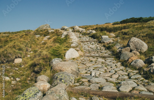 Sendero hecho con rocas de granito en la Sierra de Gredos. Sendero junto a la Garganta de Prado Puerto al inicio del sendero de la Laguna Grande, Big Lake, en Navacepeda de Tormes, Avila, España. photo