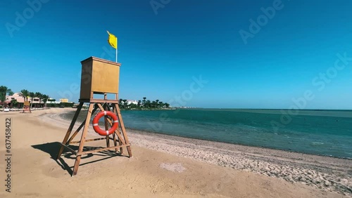 Egyptian Lifeguard Tower Amidst Strong Winds with Yellow Flag