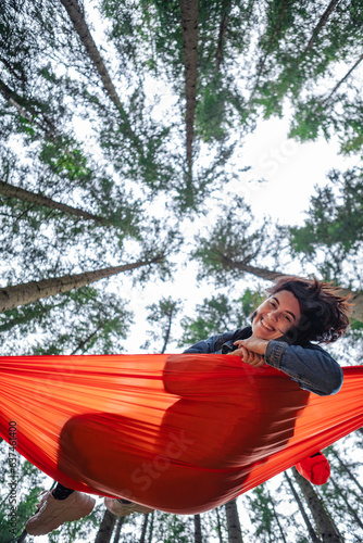 happy woman on hammock in the forest © phpetrunina14