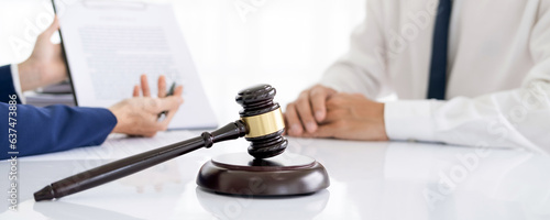 Attorneys or lawyers who are reading the statute of limitations Consultation between male lawyers and business clients, tax and legal and legal services firms.
