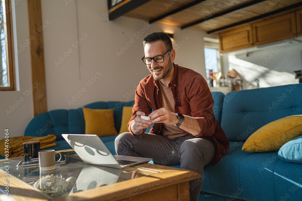 man sit at home use laptop computer to watch movie or have video call