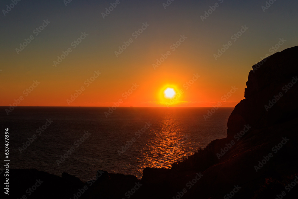 View of the Atlantic Ocean from Cabo da Roca at sunset. Cabo da Roca or Cape Roca is westernmost cape of mainland Portugal, continental Europe and the Eurasian land mass