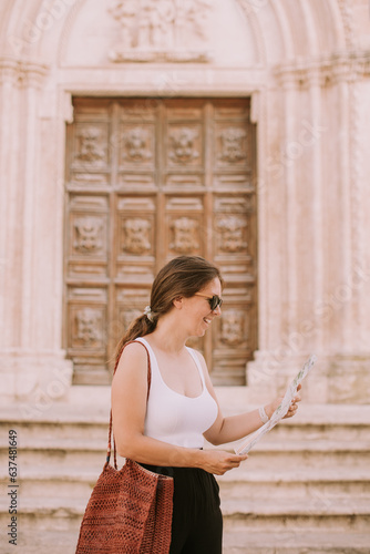 Female tourist with city ma...