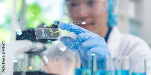 Obraz na płótnie Asian woman Scientific Exploration: Microbiologist experiment Green Leaf in the Laboratory , Biotech concept w salonie