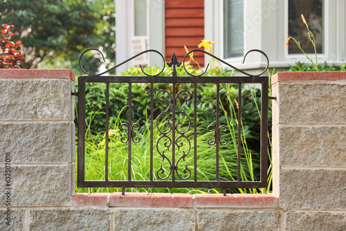 Metal fence: Symbol of boundaries and security; conveys separation and protection. Metaphor for division and safeguarding spaces. Stark, functional photo