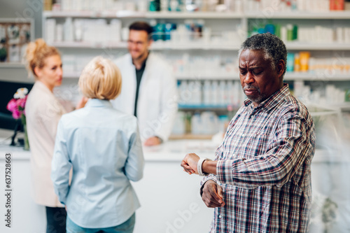 Portrait of a senior african american man patient in a pharmacy