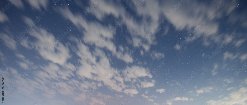 Fototapeta premium Night starry sky background with clouds .