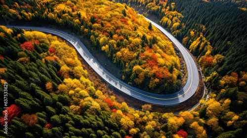 Aerial view of car traveling on winding mountain road in a forest. Generative AI