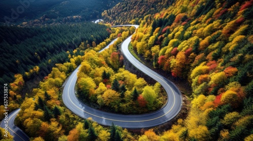 Aerial view of car traveling on winding mountain road in a forest. Generative AI