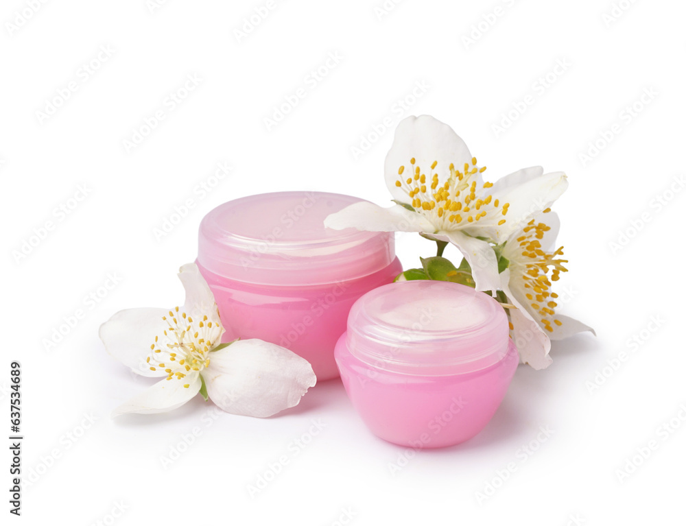 Jars of cosmetic products and beautiful jasmine flowers on white background Jars of cosmetic products and beautiful jasmine flowers on white background