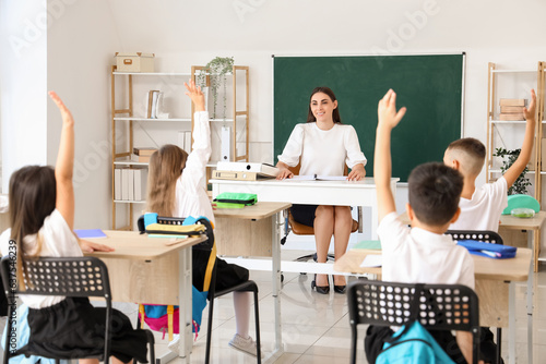 Female teacher conducting lesson in classroom