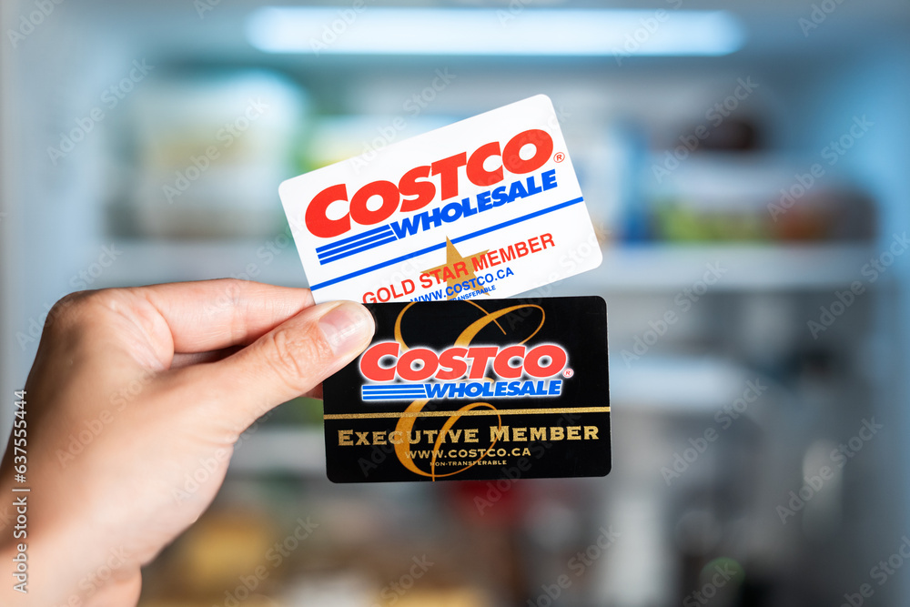 Costco Membership Comparison in front of a refrigerator Stock Photo