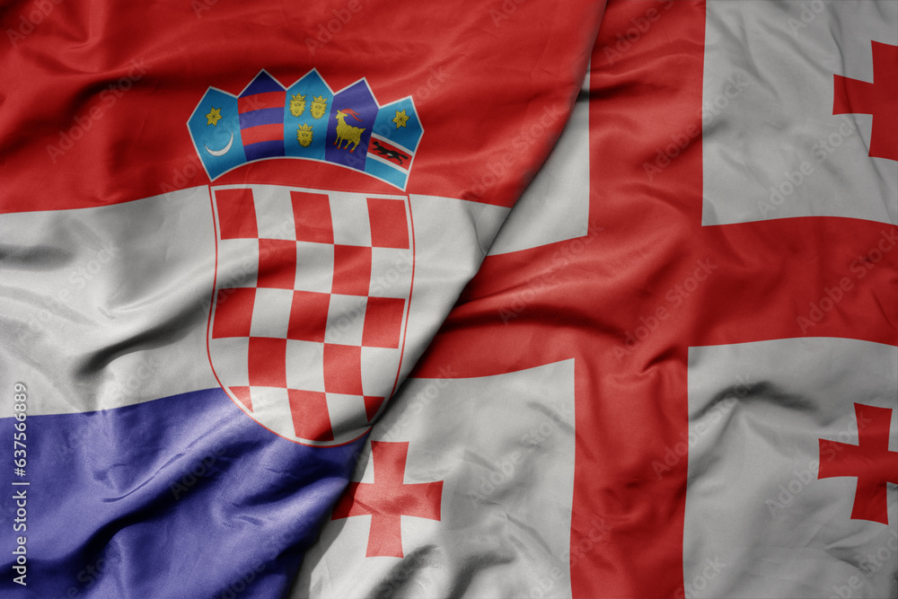 Fototapeta premium big waving national colorful flag of croatia and national flag of georgia .