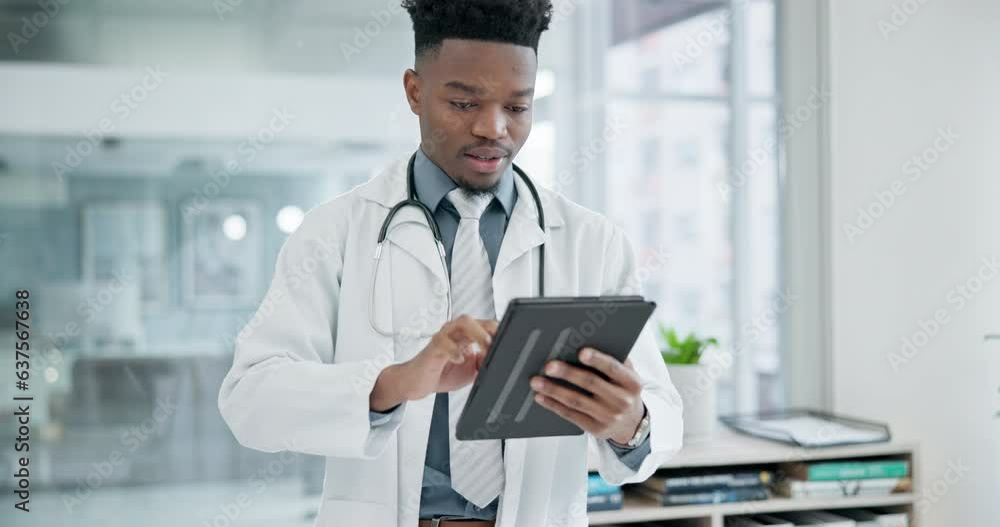 Research, tablet and a doctor black man in the hospital for healthcare or innovation in modern treatment. Medical, technology and data with a happy medicine professional in a clinic for breakthrough Research, tablet and a doctor black man in the hospital for healthcare or innovation in modern treatment. Medical, technology and data with a happy medicine professional in a clinic for breakthrough