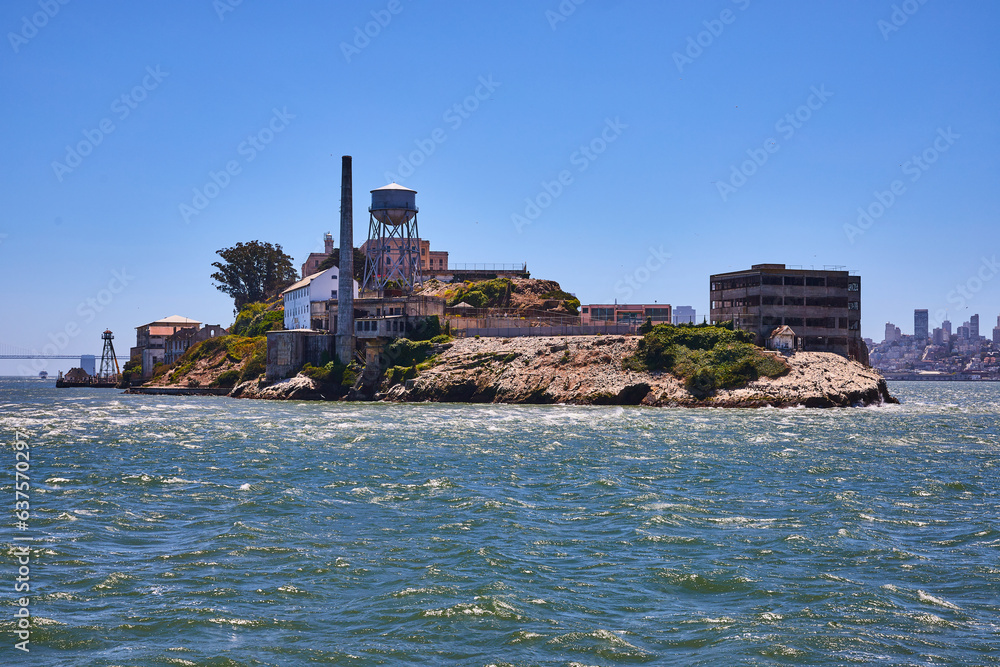 Close view of east side of Alcatraz Island on bright summer day with clear blue skies