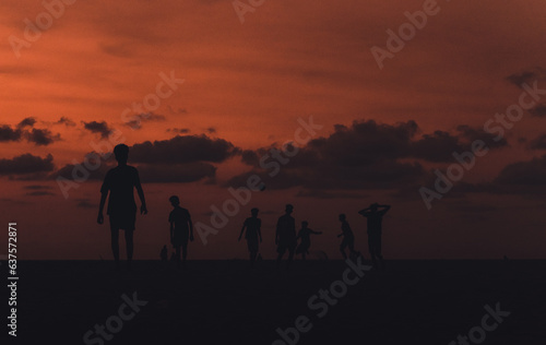 silhouette of people on the beach
