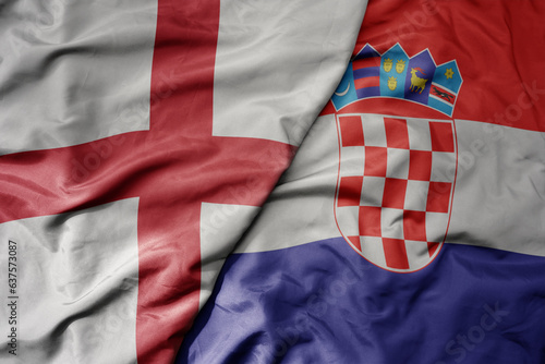 big waving national colorful flag of england and national flag of croatia .