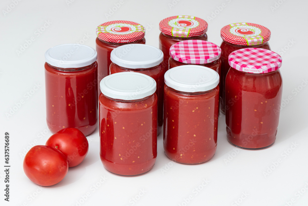 Homemade tomato sauce in the jars traditional prep for the winter months. Homemade tomato sauce in the jars traditional prep for the winter months.