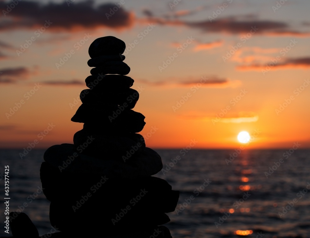 Stones in sunset by ocean.