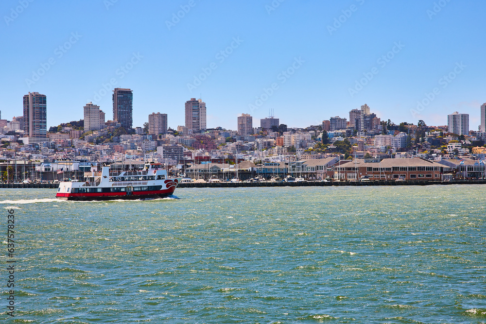 Royal Prince tour boat on choppy waters in San Francisco Bay with city view