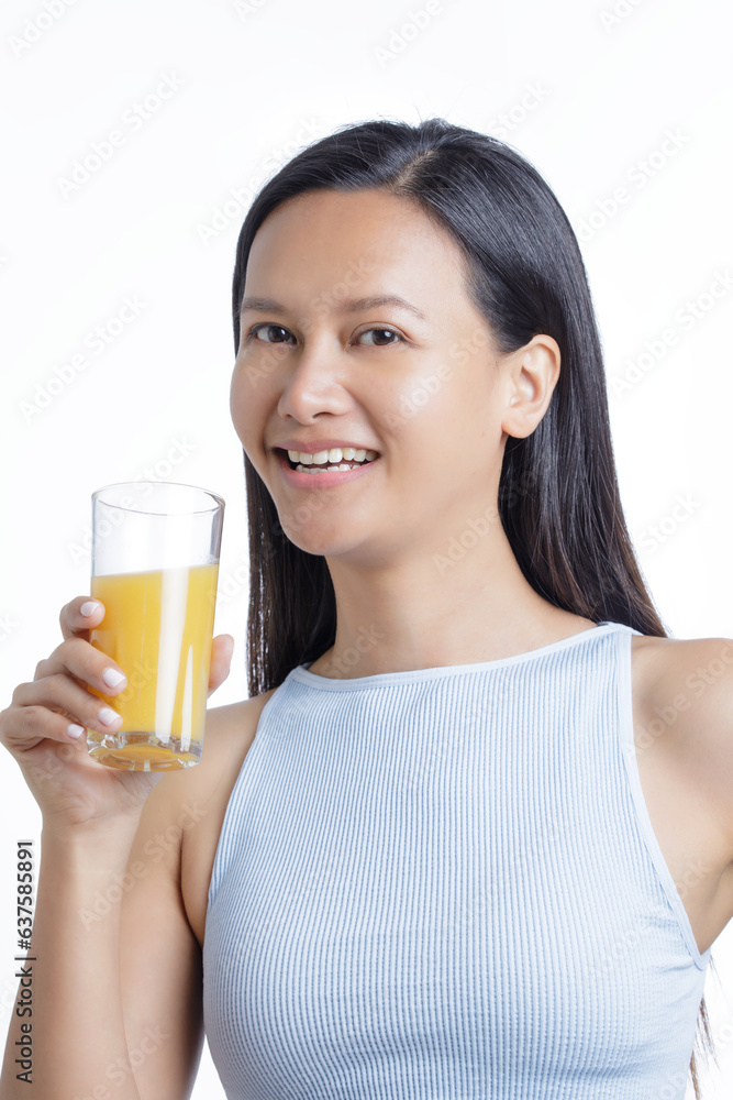 Asian American Woman drinking a glass of Orange Juice Asian American Woman drinking a glass of Orange Juice