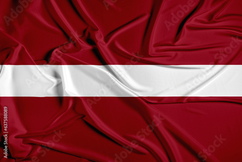 Latvia official national flag of silk fabric texture photo