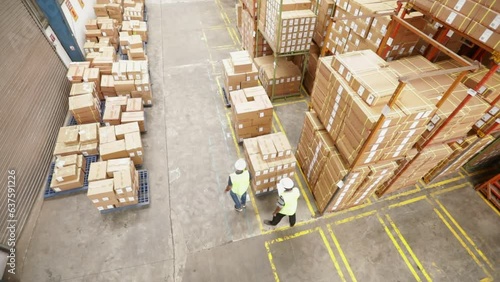 Warehouse Workers Inspect Cardboard Boxes