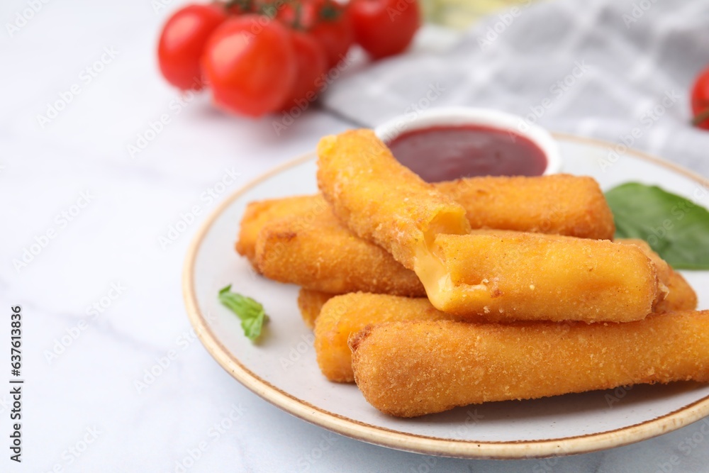 Tasty fried mozzarella sticks with tomato sauce on white table, space for text