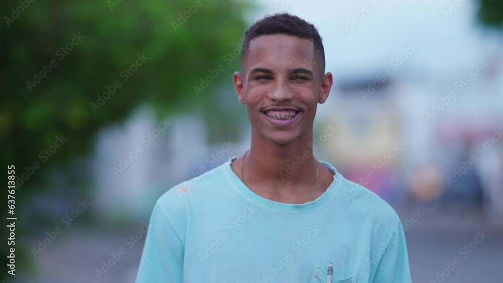 Authentic Portrait of happy Young Brazilian Man in Urban City Street, Real People of South America Authentic Portrait of happy Young Brazilian Man in Urban City Street, Real People of South America