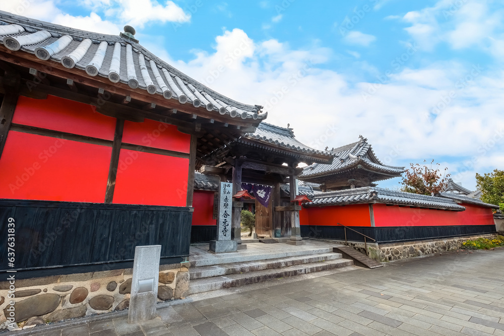 Nakatsu, Japan - Nov 26 2022: Goganji Temple (Red Wall Temple) established by daimyo Kuroda Yoshitaka and founded by the priest Kuyo, situated a little south of the center of the Tera-machi district