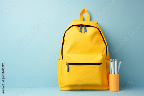 Full school backpack with books isolated on blue background with copy space. Back to School concept - Created with Generative AI technology.