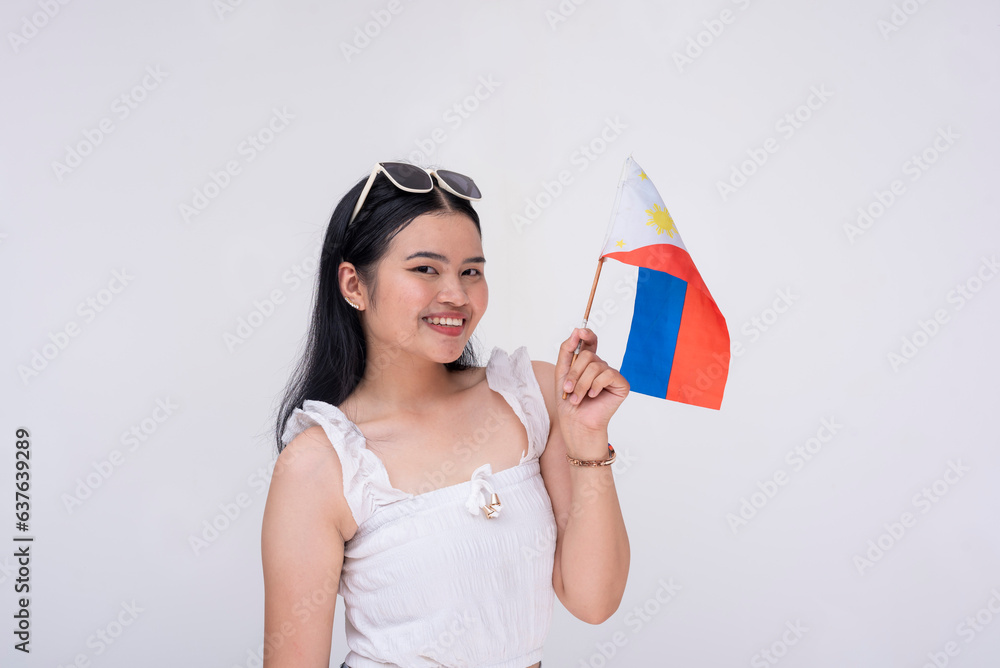 Portrait of a proud FIlipina woman waving the Philippines national flag. Patriotic young lady proud of her roots. Isolated on Portrait of a proud FIlipina woman waving the Philippines national flag. Patriotic young lady proud of her roots. Isolated on