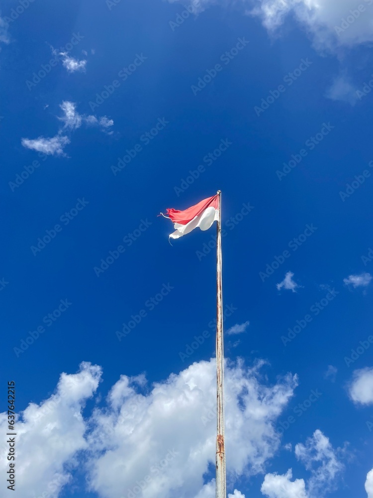 Indonesian flag on blue sky