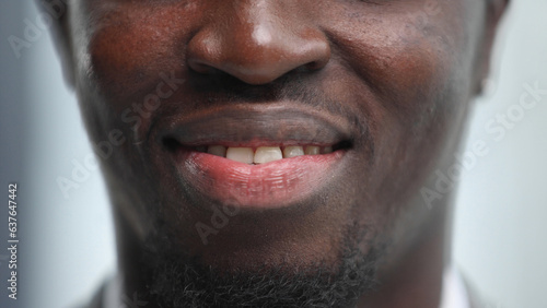Close-up image of the lips of a black young man