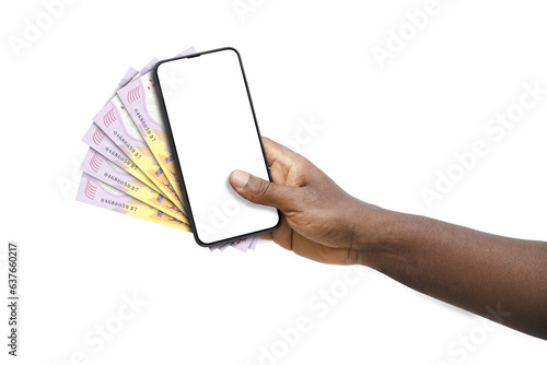 Black hand holding mobile phone with blank screen and Central African CFA franc notes photo