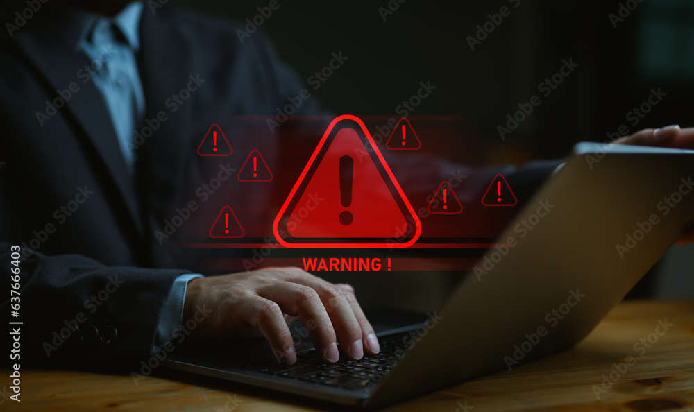 Businessman, IT staff, programmer, developer using computer with triangle caution warning sign for notification error and maintenance concept. System warning error popup and maintenance showing. - obrazy, fototapety, plakaty 